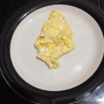 A plate of cooked omelet on the table