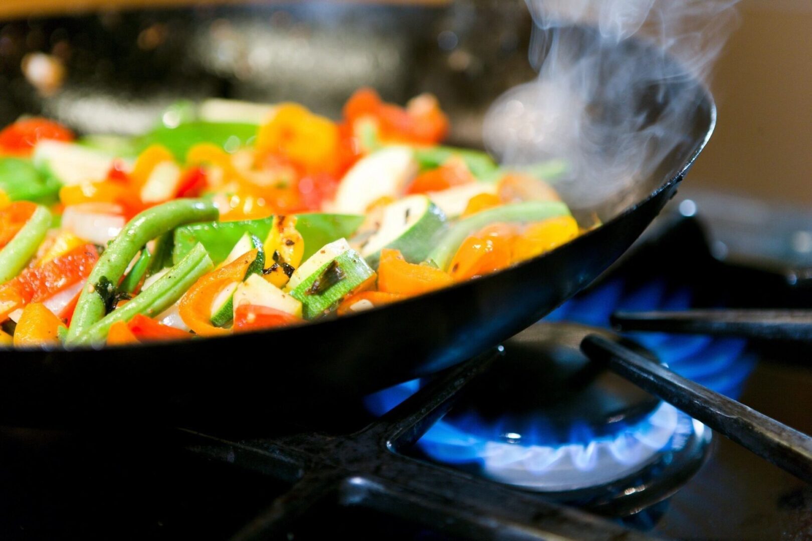 closeup shot of veggies being cooked