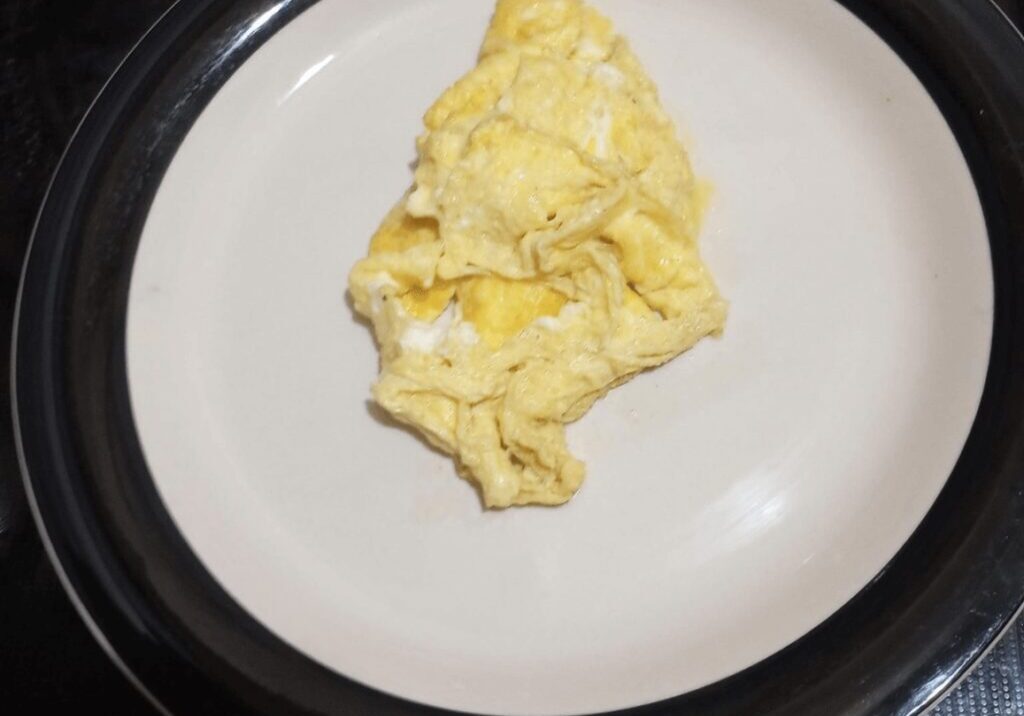 A plate of cooked omelet on the table