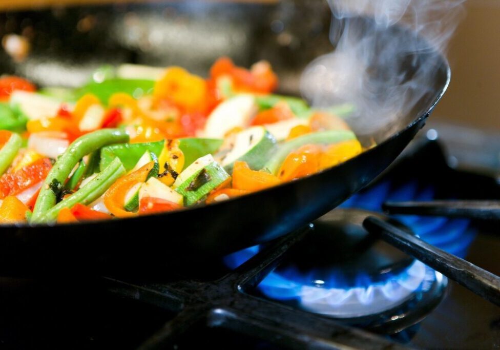 closeup shot of veggies being cooked